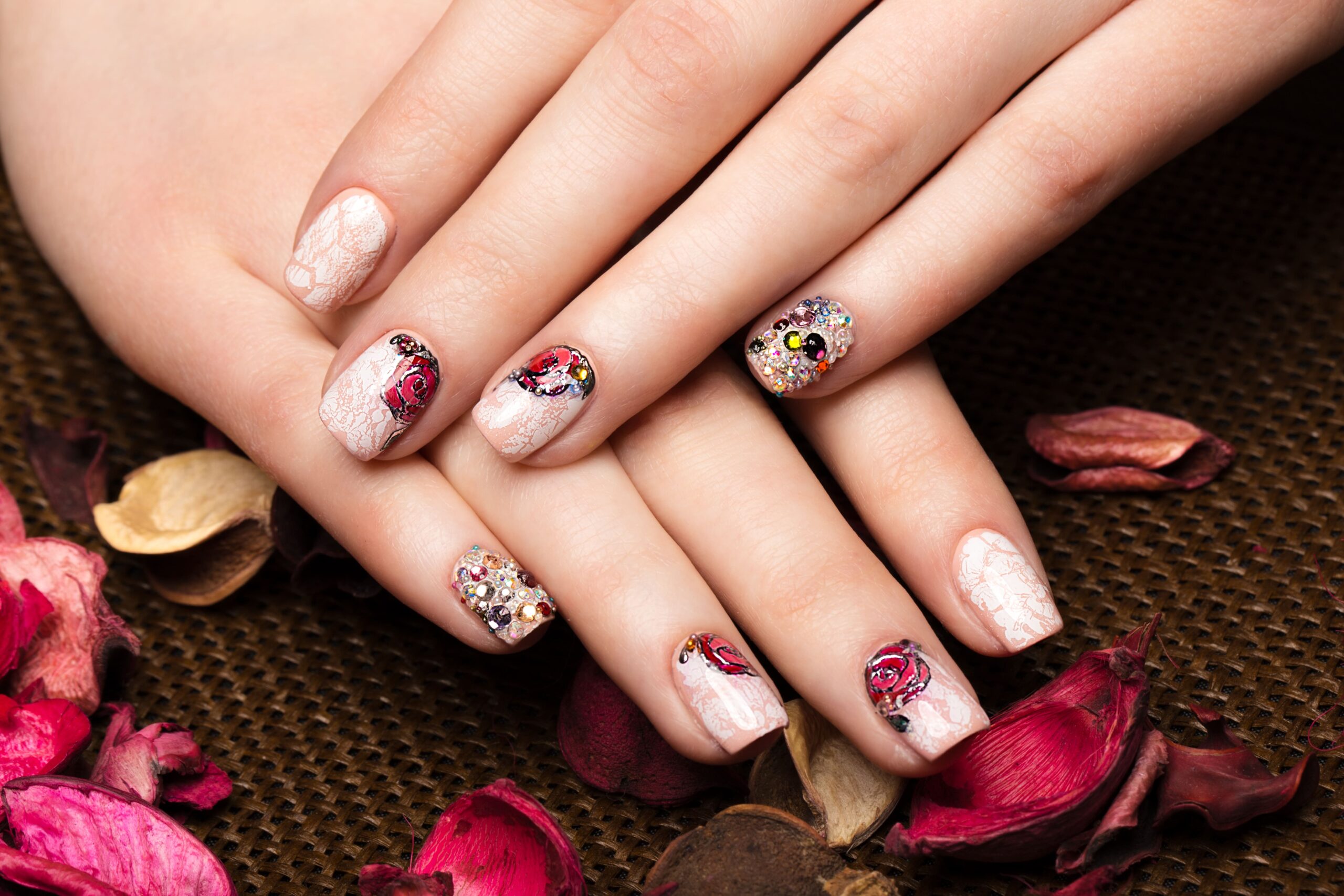 beautiful-manicure-with-flowers-female-fingers-nails-design-closeup-picture-taken-studio-white-background-min | JNY Nails